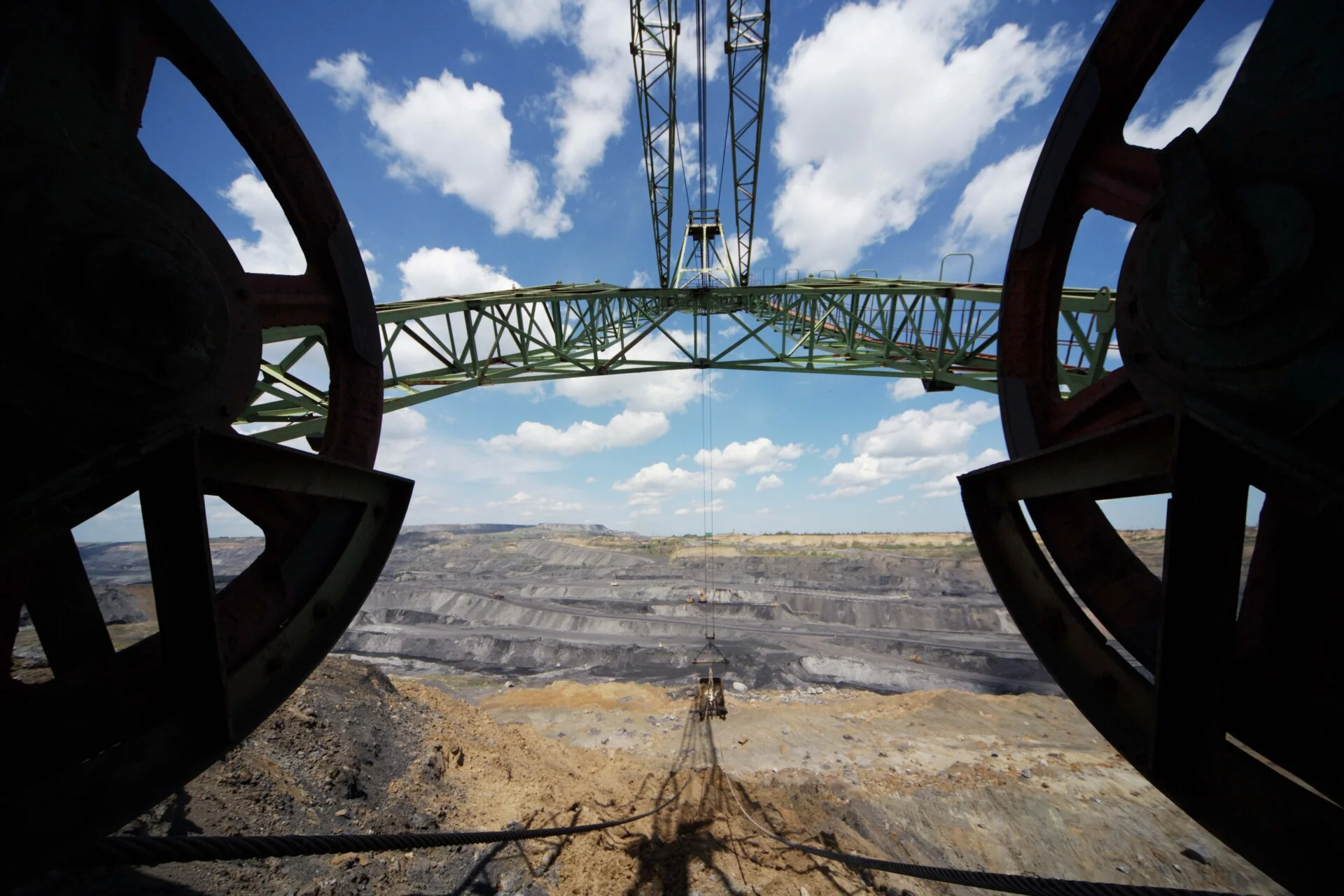 Large mining excavator overlooking an open-pit coal mine, illustrating pressure on the Russian coal industry