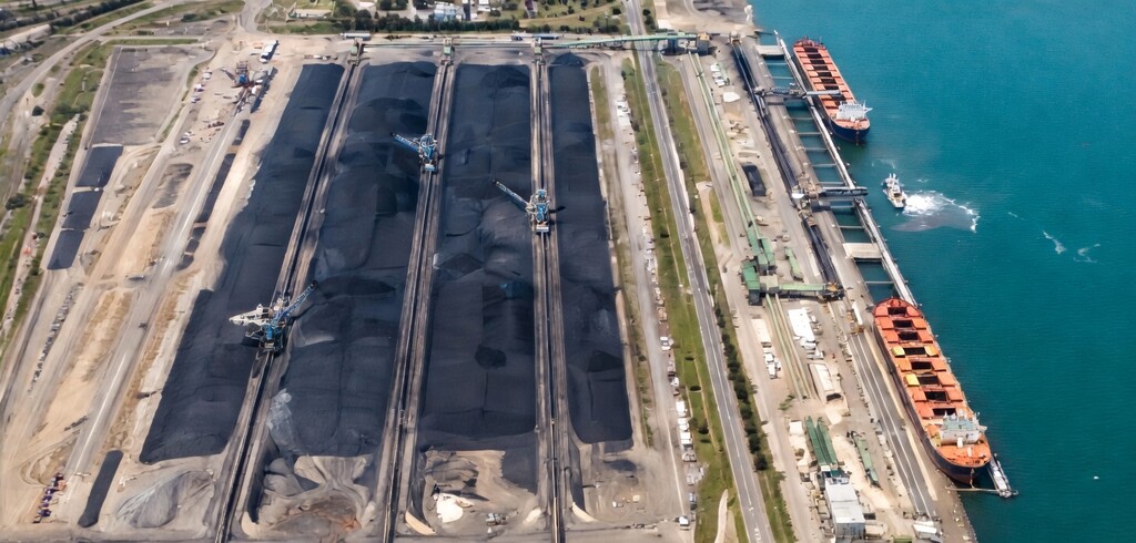 Coal stockpiles and bulk carriers at a coal export terminal