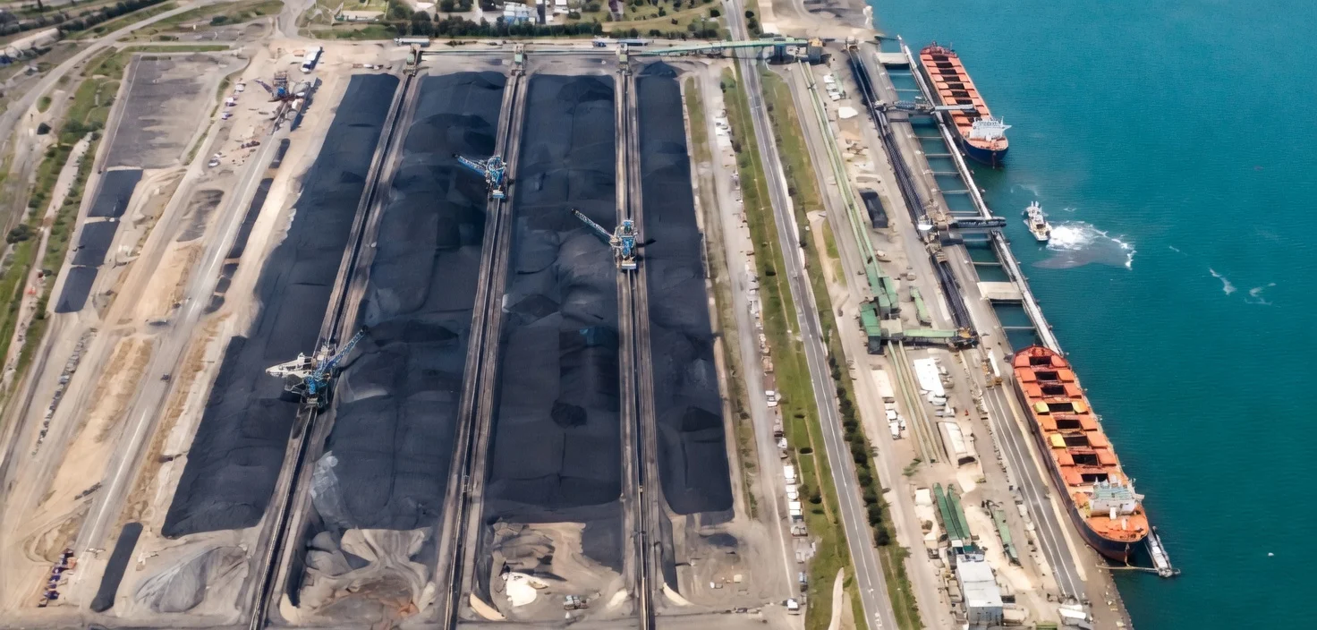 Coal stockpiles and bulk carriers at a coal export terminal