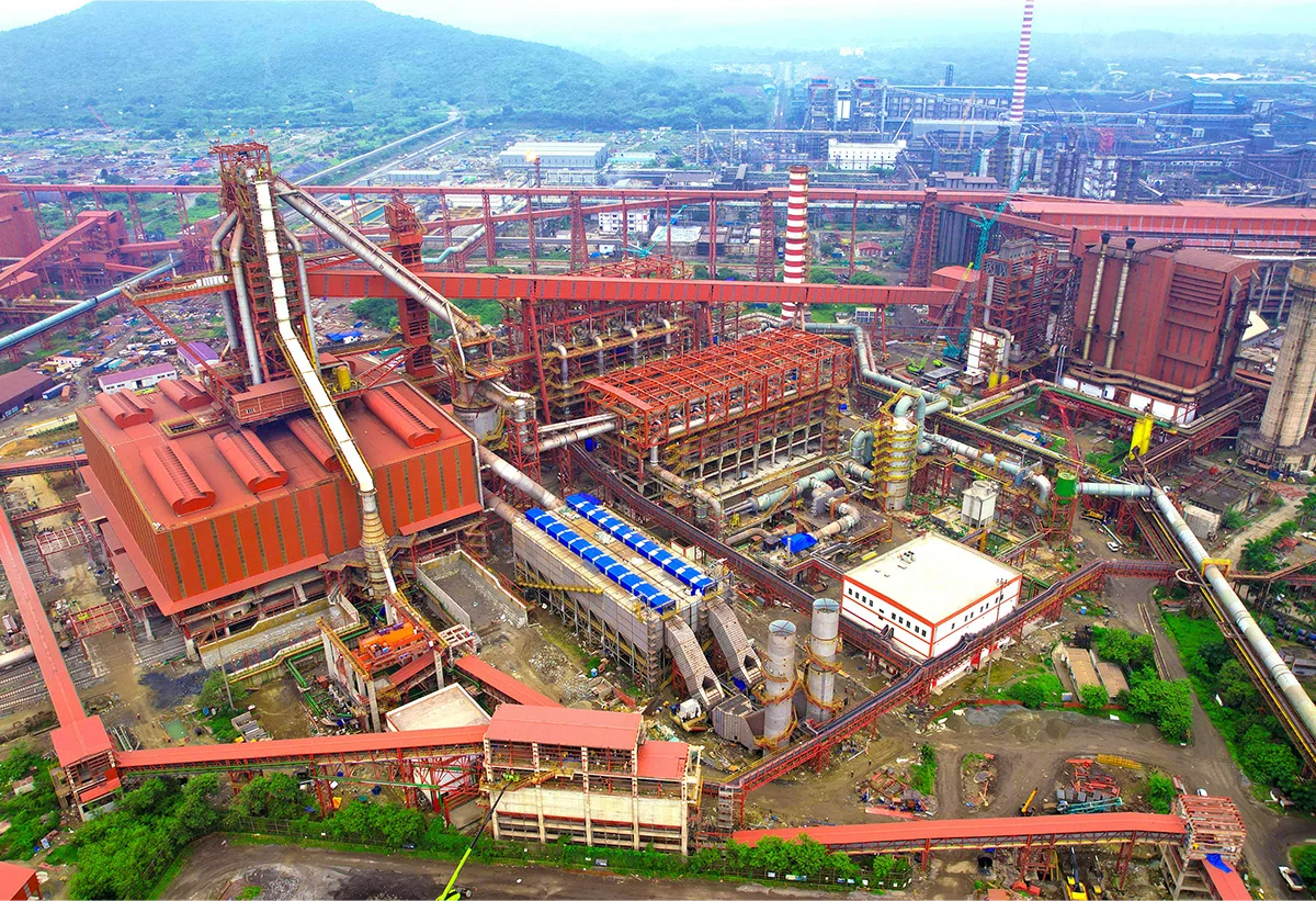 Indian steel plant and industrial infrastructure | The Coal Hub | The Coal Hub Aerial view of a large Indian steel plant with blast furnace structures, chimneys, conveyors and industrial processing units.