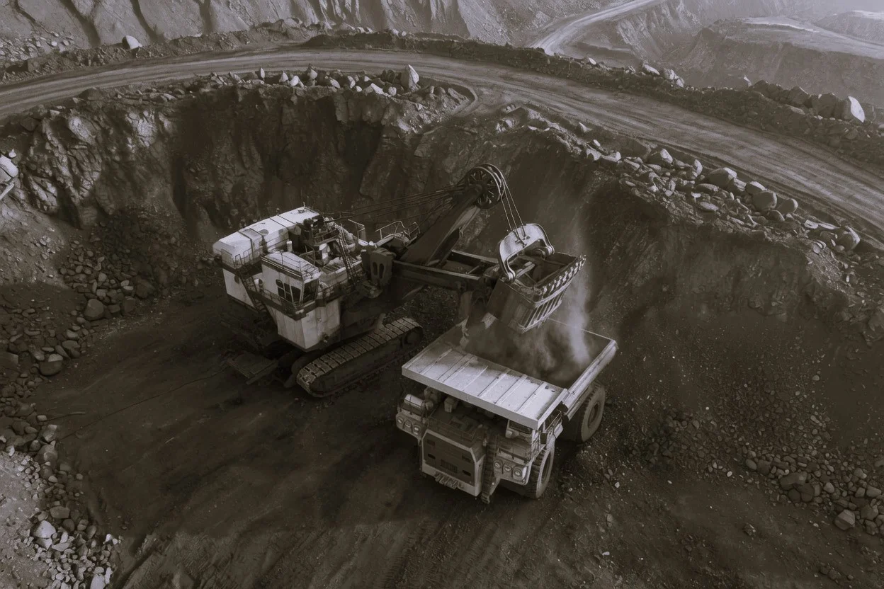 Russian coal companies face mounting losses in 2026 | The Coal Hub Excavator loading coal into a haul truck at an open-pit Russian coal mine